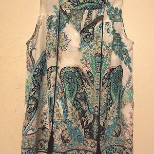 Sleeveless dressy top creamy silky look and feel